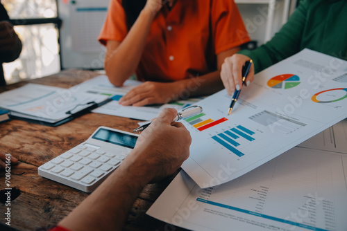 Co working conference, Business team meeting present, investor colleagues discussing new plan financial graph data on office table with laptop and digital tablet, Finance, accounting, investment. photo