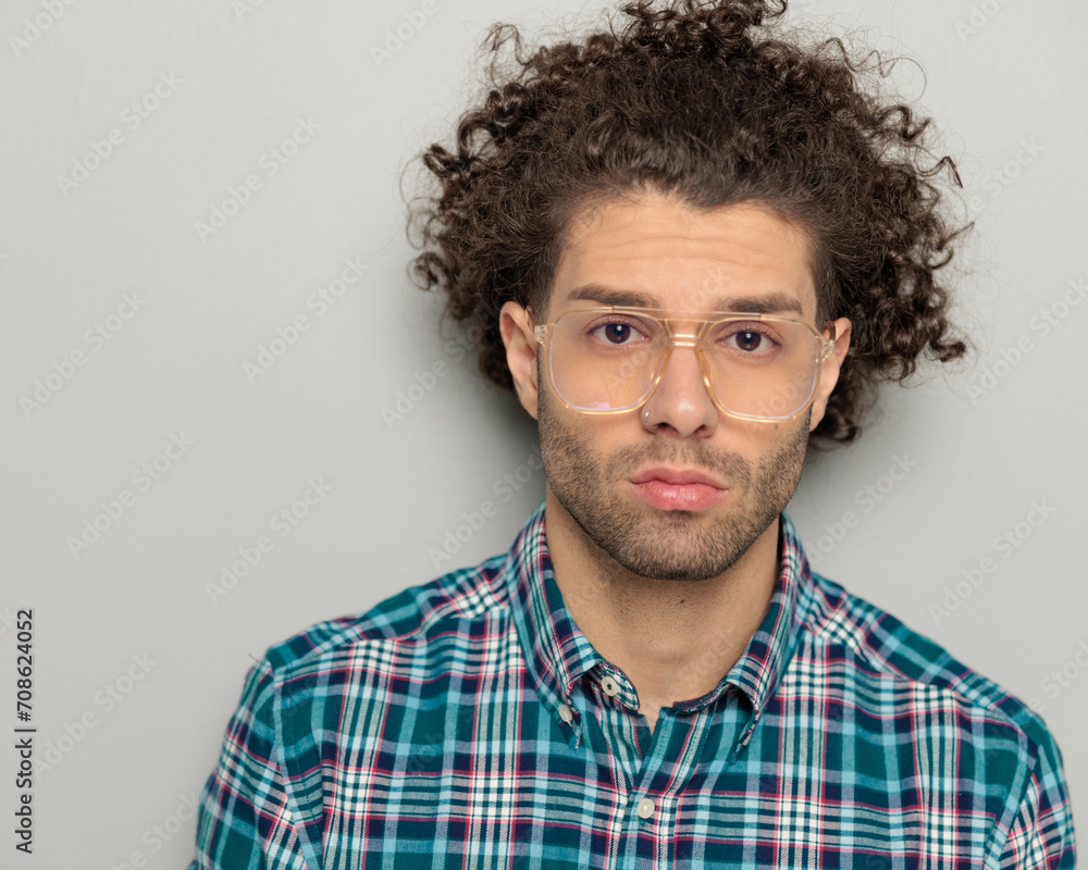close up picture of curly hair man with glasses looking forward close up picture of curly hair man with glasses looking forward