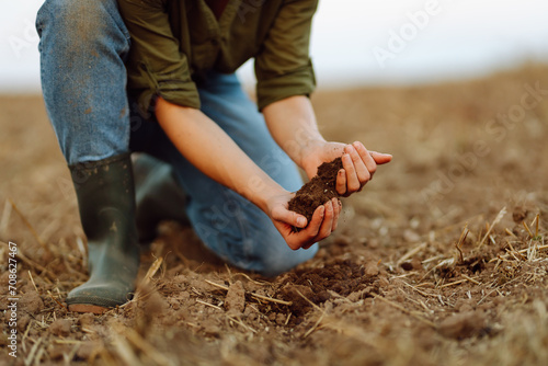 Soil in hands for check the quality of the soil for control soil quality before seed plant.  Gardening and agriculture concept. photo