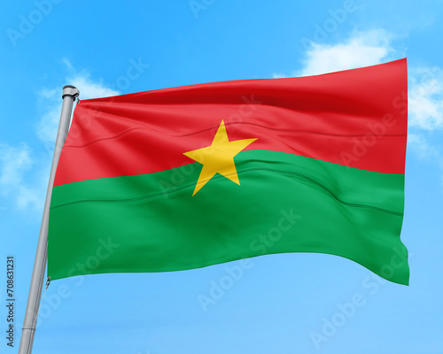 Burkina Faso flag fluttering in the wind on sky.