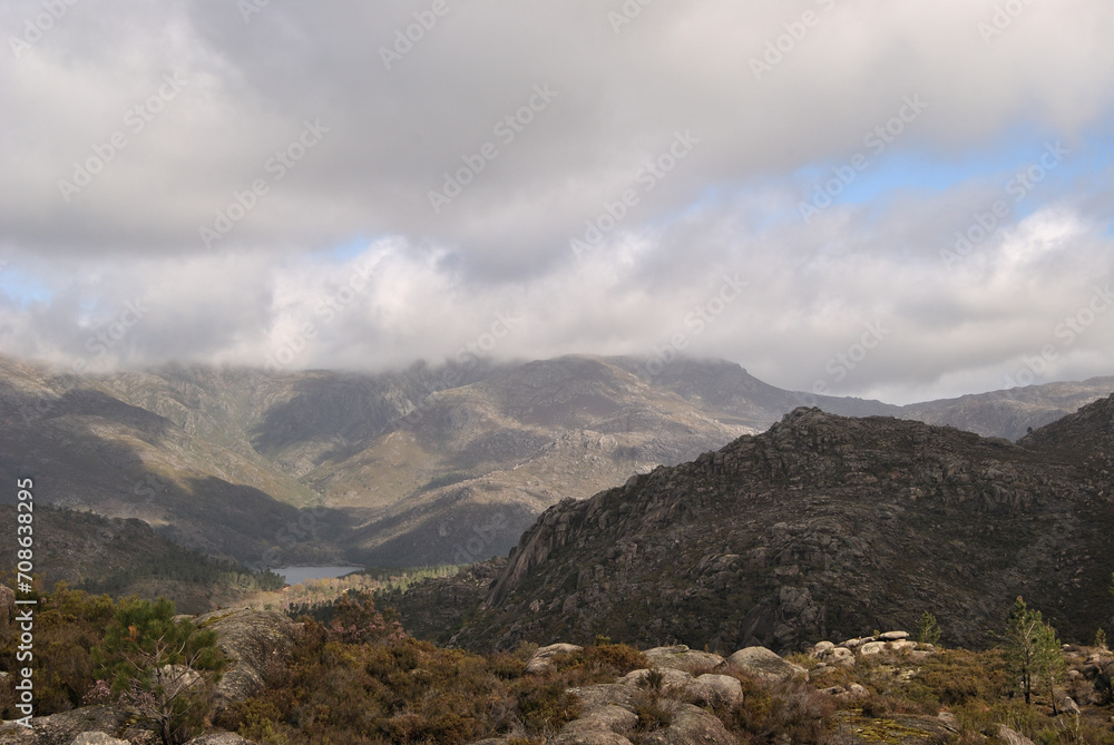 Naklejka premium Mountains landscape with small lake and cloudy sky, Gerês mountain in Portugal