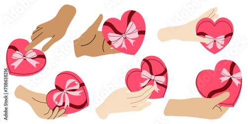 Set of hands holding a pink heart shaped gift box. Love concept. Gift, gift for Valentine's Day, birthday or Christmas. View from above. Trendy flat vector illustration on white background.
