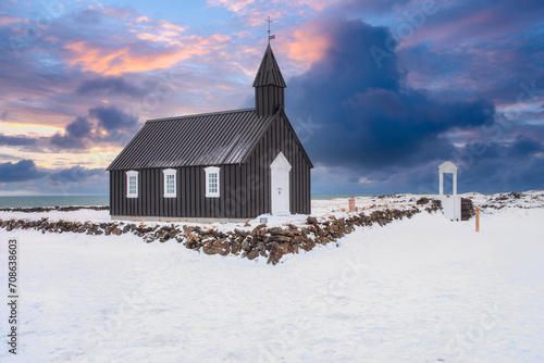 The little black church of Budir, Black Church. South coast of Snaefellsnes peninsula In the West of Winter Iceland photo