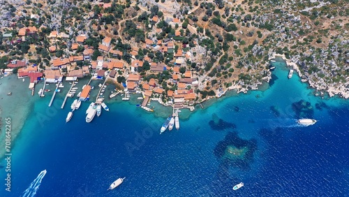 Aerial top down view of Ancient village of Simena beach and yachts, display the historic site and enchanting Mediterranean landscape in Turkey. Daily tour boats stop for a max of 1 hour at village photo