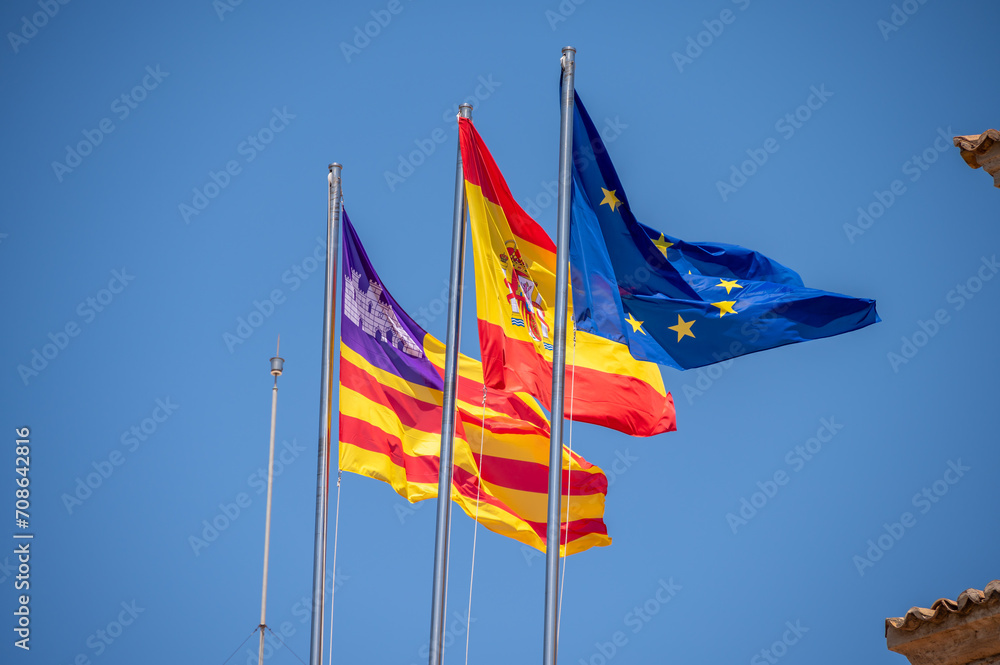 Spanish and European Union flags in summer. Palm de Mallorca. Spanish and European Union flags in summer. Palm de Mallorca.