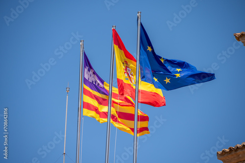 Spanish and European Union flags in summer. Palm de Mallorca. photo