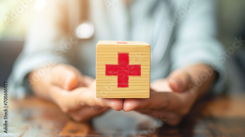 Hand pushing green correct sign symbol in front of Red Cross sign on wooden block cube for business proposal and document approve concept