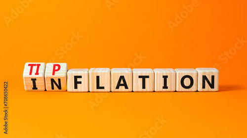 Inflation or tipflation symbol. Concept words Inflation Tipflation on beautiful wooden blocks. Beautiful orange table orange background. Business inflation Tipflation concept. Copy space