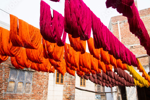 Colorful textile threads hanging to dry
