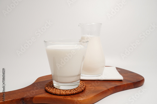 Fresh milk drink in a clear glass, white background