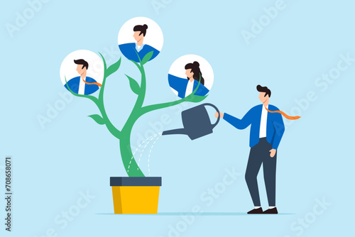 Businessman HR watering and growing tree with employees in flat design