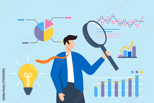Businessman analyzing data with magnifying glass photo