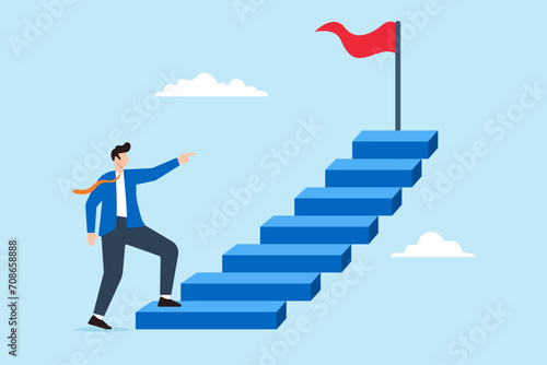 Businessman climb stairs to achieve goal photo