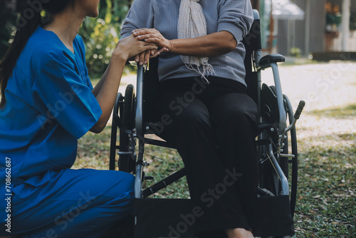 Young asian caretaker with 60s asia elderly woman consulting and encourage, take a history and recommend the right treatment to live happily in retirement, holding hands and encouraging photo