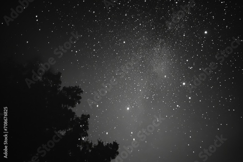 A captivating black and white photo of the night sky. Perfect for use in astronomy-related projects or to create a dramatic atmosphere in various designs