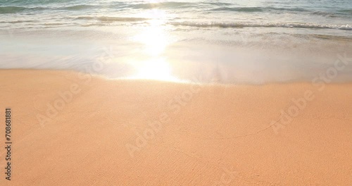 Prestine beach front with peaceful waves washing clean sea sand photo