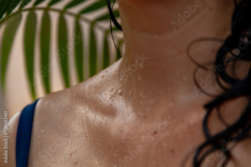 Water drops on wet body of woman in swimsuit....