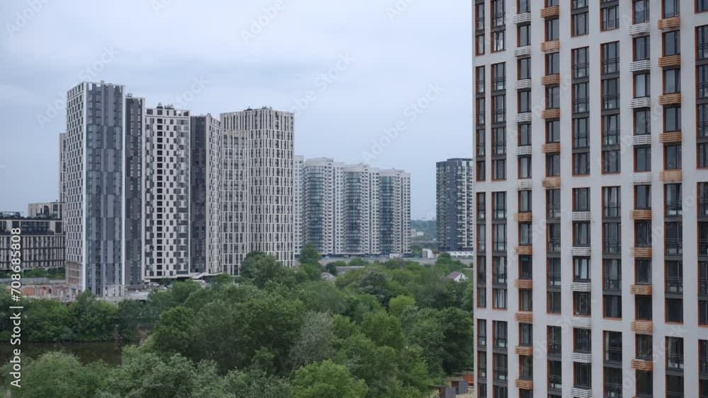 Urban development of a modern city. View from the window of an apartment in a multi-apartment residential complex Urban development of a modern city. View from the window of an apartment in a multi-apartment residential complex