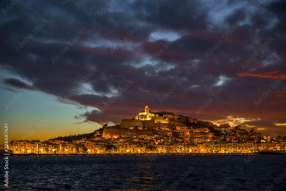 sunset over the city ibiza spain island party old town wide panaromic view cloudy blue hour evening light golden 