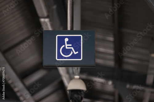 Accessible Elevator with sign. Disabled persons lift near modern apartment facility. The special elevator for the disabled at the entrance to the living house. Equipment with the wheelchair..