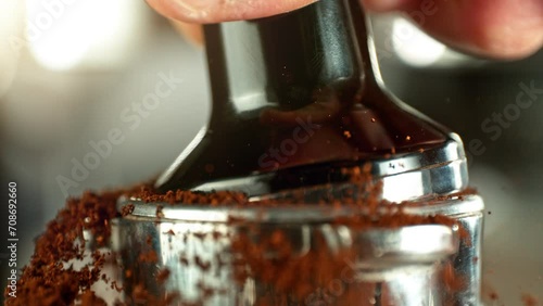 Super Slow Motion of Tamping Ground Coffee. Close-up, Macro Shot, Coffee Machine Accessories. Filmed on High Speed Cinema Camera, 1000fps.