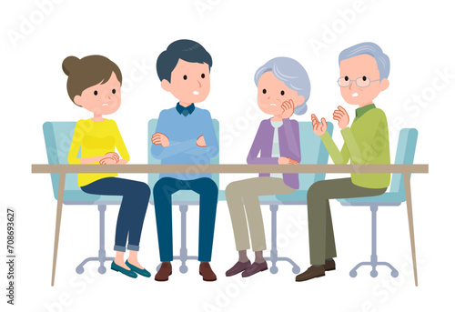 話し合う夫婦とその両親。