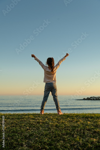 person jumping on the beach