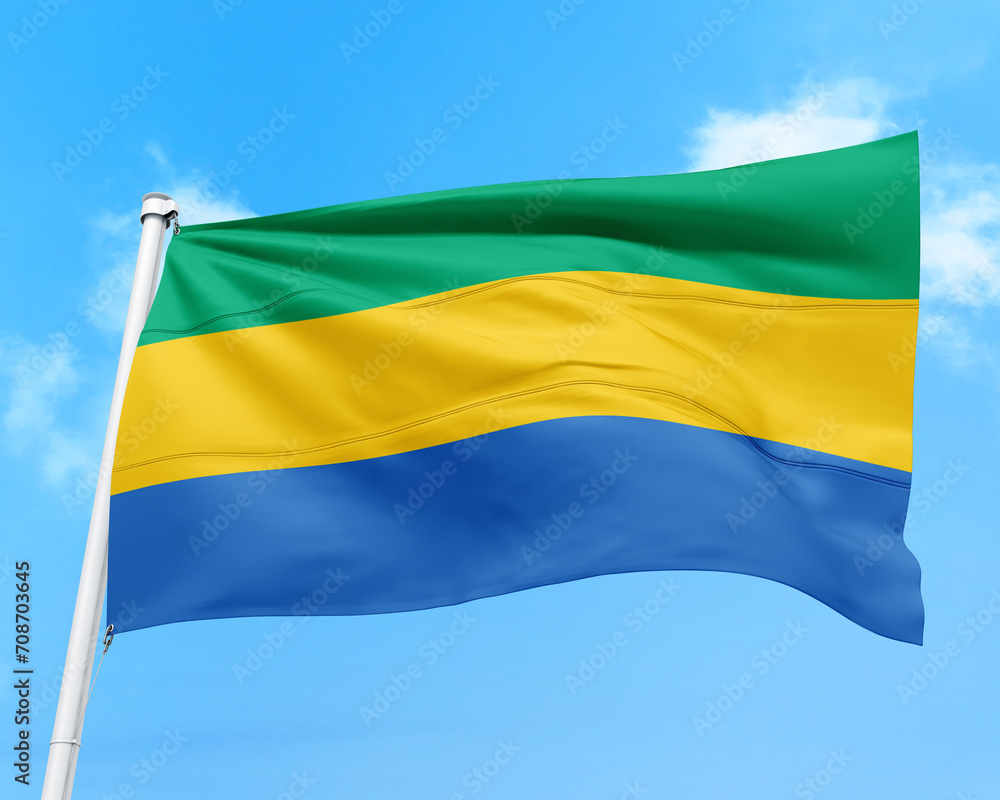 Fototapeta premium Gabon flag fluttering in the wind on sky.