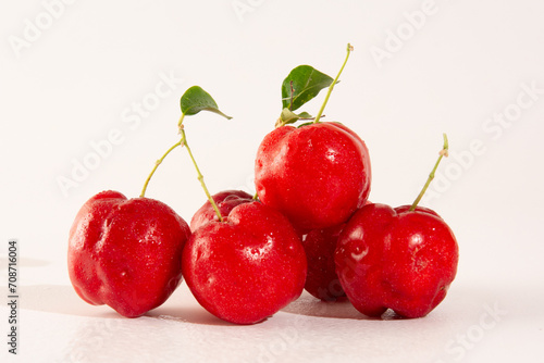 Freshly Harvested Organic Acerolas on a white table and clean background in front view