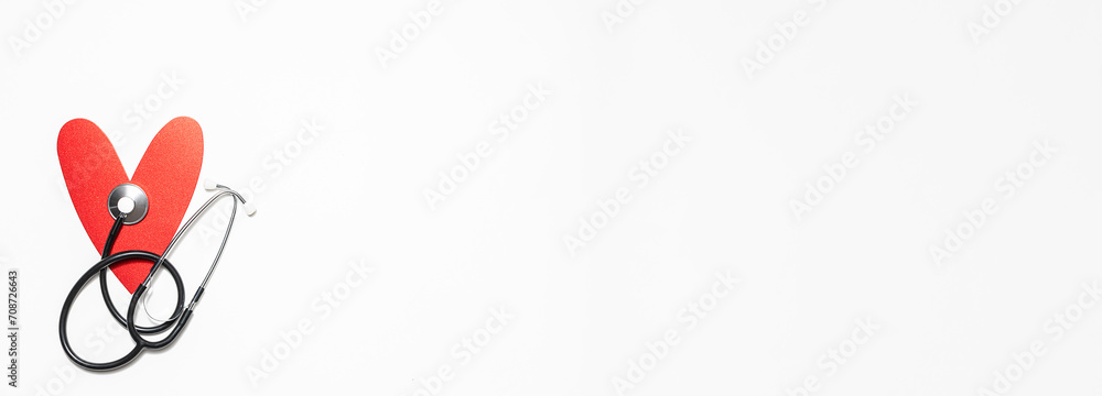 Decorative red heart and medical stethoscope on white background long banner format. Decorative red heart and medical stethoscope on white background long banner format.