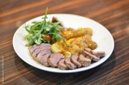 rosemary duck breast steak with vegetables and caramelized fruit
