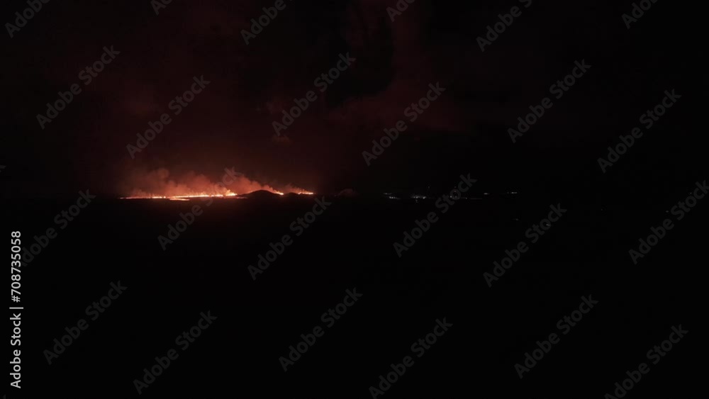 Aerial video of distant lava trail, volcano eruption in Iceland, Europe Aerial video of distant lava trail, volcano eruption in Iceland, Europe