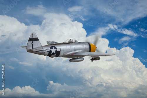 Foto P-47 Thunderbolt fighter (model) patrols the skies above the clouds