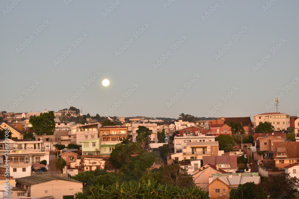 Calm skyline of Anamalahisty, Antananarivo, Madagascar with the moon in the sky