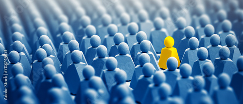 Yellow figure distinct among blue crowd, representing the concept of finding the right person in HR, business strategy, and organizational psychology photo