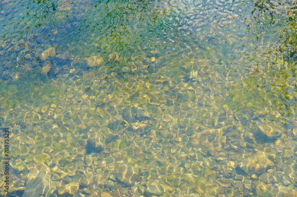 shinny pebbles in the water shinny pebbles in the water