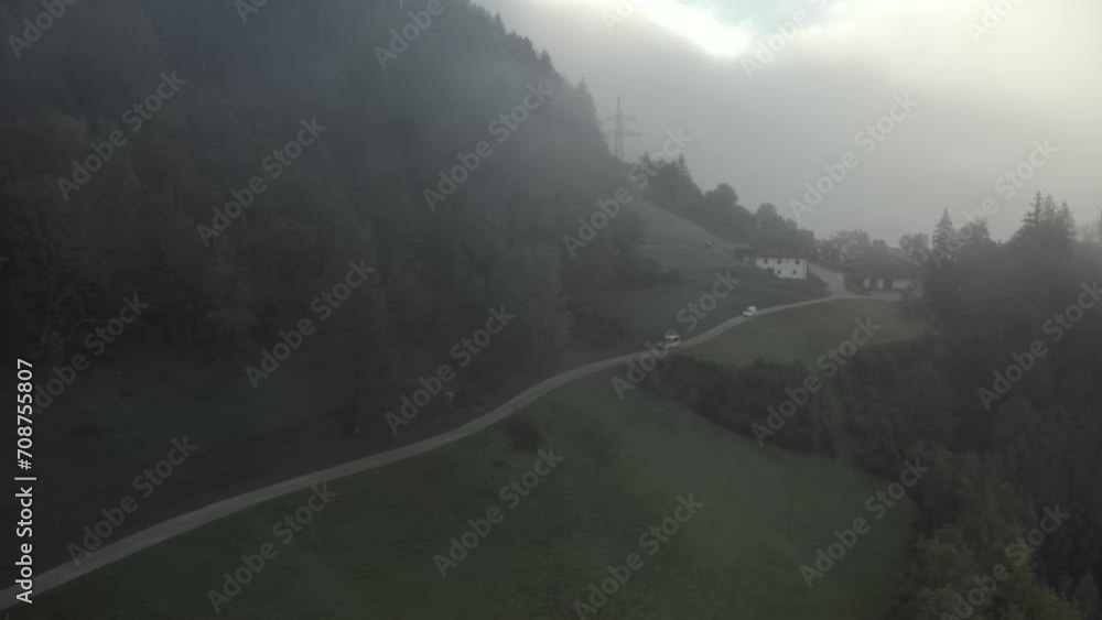 A car drives in the fog on the roads of Schloss Sprechenstein Pietra Castle A car drives in the fog on the roads of Schloss Sprechenstein Pietra Castle