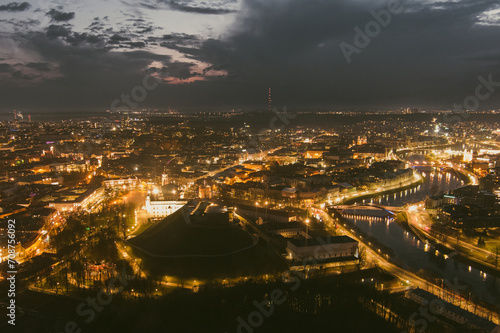 Scenic aerial view of Vilnius Old Town and Neris river at nightfall. Night view of Vilnius, Lithuania.