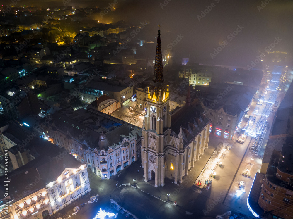 Mysterious smoggy Novi Sad aerial view on Cathedral in winter night, Serbia