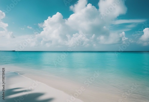 Beautiful sandy beach with white sand and rolling calm wave of turquoise ocean on Sunny day White cl
