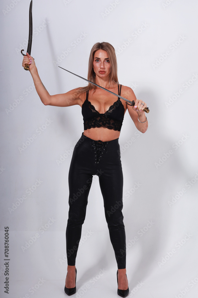 Boudoir model in lingerie with two old swords Boudoir model in lingerie with two old swords