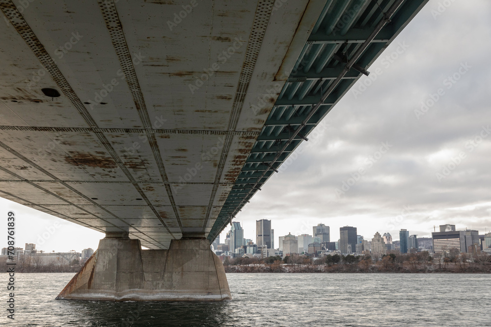 under the bridge with the Montreal skyline view