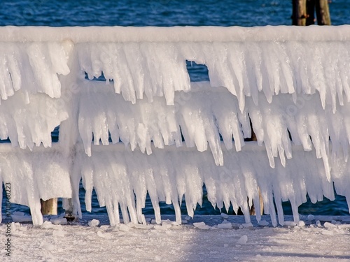 Ice covers rails of a pier in Sidney BC during unusual cold snap © pr2is
