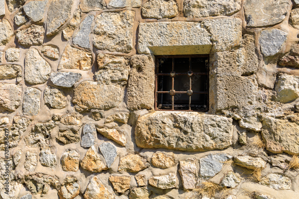 Window in an ancient fortress. Background with selective focus and copy space Window in an ancient fortress. Background with selective focus and copy space