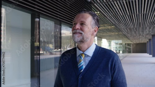 Wallpaper Mural Portrait cheerful adult Caucasian gray haired business man happy expression walking outdoors office. Finance male in formal smiling outside office. Senior professional looking at the camera Torontodigital.ca