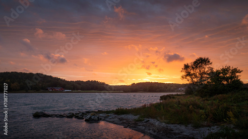 Photos Sunset with colourful clouds in the sky at a lake on the archipelago island of Tjörn in the west of Sweden