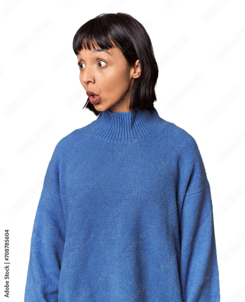 Young Hispanic woman with short black hair in studio being shocked because of something she has seen. Young Hispanic woman with short black hair in studio being shocked because of something she has seen.