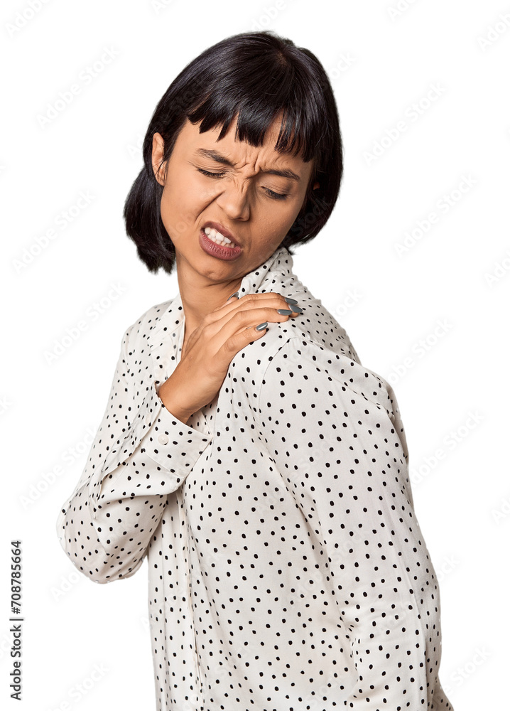 Young Hispanic woman with short black hair in studio having a shoulder pain. Young Hispanic woman with short black hair in studio having a shoulder pain.
