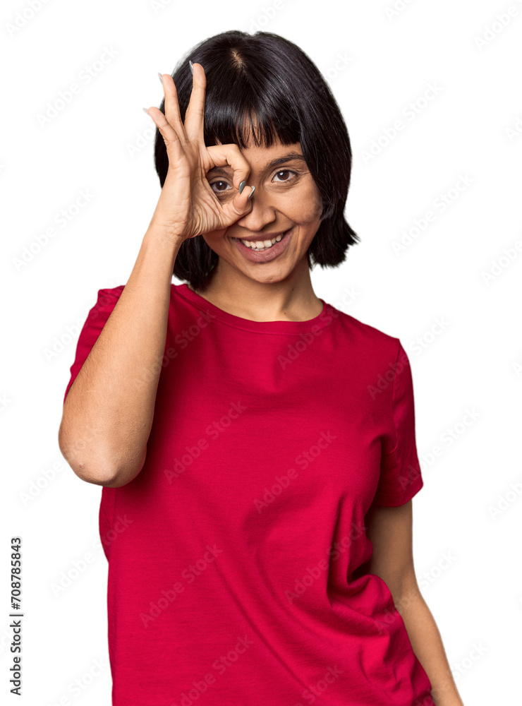 Young Hispanic woman with short black hair in studio excited keeping ok gesture on eye. Young Hispanic woman with short black hair in studio excited keeping ok gesture on eye.