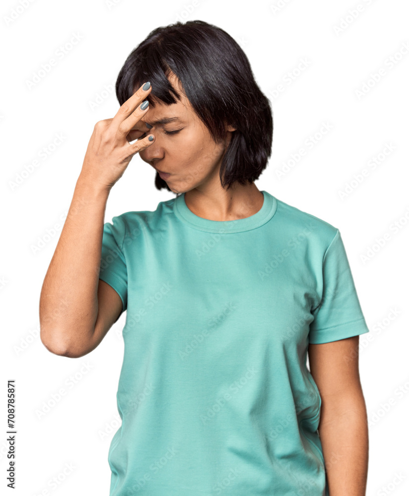 Young Hispanic woman with short black hair in studio having a head ache, touching front of the face. Young Hispanic woman with short black hair in studio having a head ache, touching front of the face.